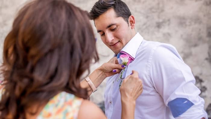  what side does a boutonniere go on